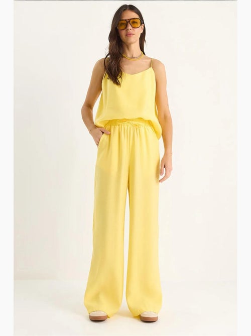 Conjunto coordenado com camisola sem mangas e calças de perna larga lucci - Kiabi Conjunto coordenado com camisola sem mangas e calças de perna larga lucci - Kiabi