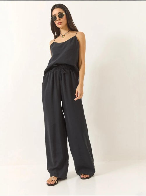 Conjunto coordenado com camisola sem mangas e calças de perna larga lucci - Kiabi Conjunto coordenado com camisola sem mangas e calças de perna larga lucci - Kiabi