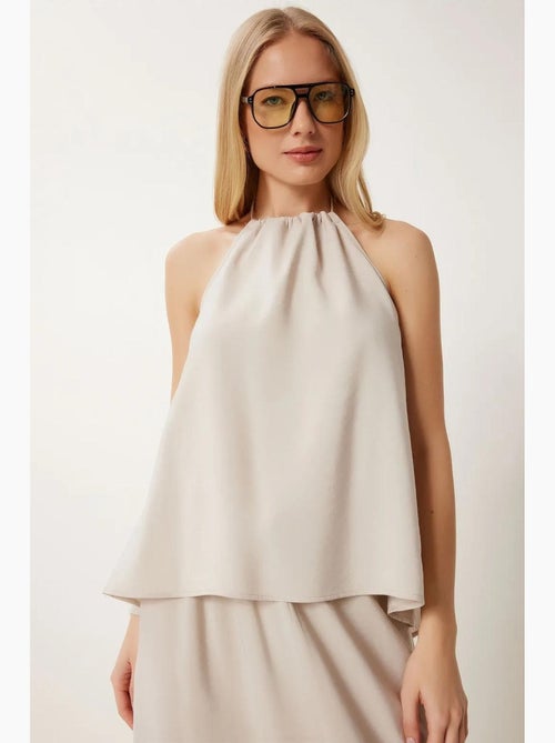 Conjunto de blusa halter com detalhe de atar e saia de perna larga istanbul - Kiabi Conjunto de blusa halter com detalhe de atar e saia de perna larga istanbul - Kiabi