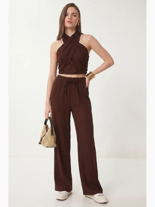 Conjunto de blusa halter e calças de perna larga istanbul - Kiabi Conjunto de blusa halter e calças de perna larga istanbul - Kiabi