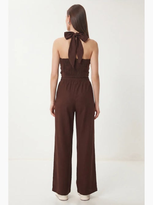 Conjunto de blusa halter e calças de perna larga istanbul - Kiabi Conjunto de blusa halter e calças de perna larga istanbul - Kiabi