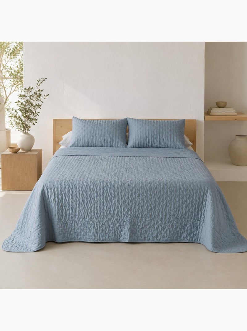 Conjunto de colcha lisa acolchoada com capa de almofada. Azul - Kiabi