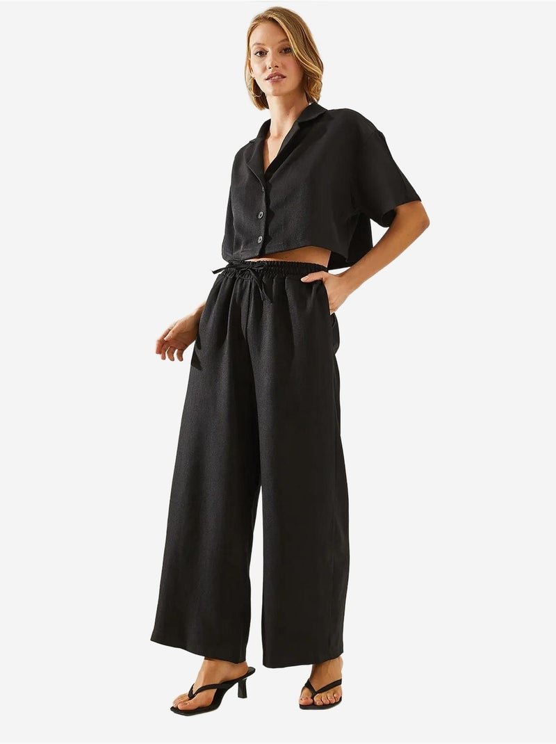 Conjunto de duas peças com blusa cropped e calças abotoadas e bolsos lucci Preto - Kiabi