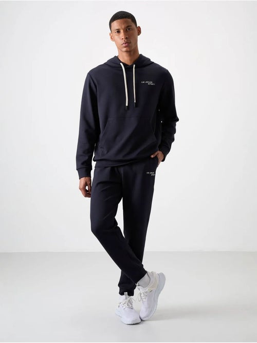 Conjunto de homem de sweatshirt com capuz e calças tommy - Kiabi Conjunto de homem de sweatshirt com capuz e calças tommy - Kiabi