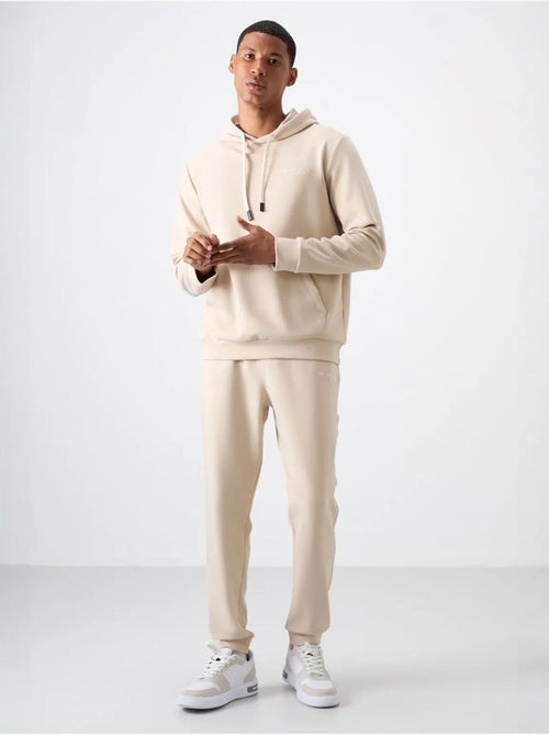Conjunto de homem de sweatshirt com capuz e calças tommy - Kiabi Conjunto de homem de sweatshirt com capuz e calças tommy - Kiabi