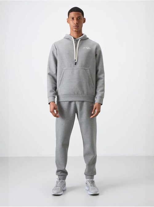 Conjunto de homem de sweatshirt com capuz e calças tommy - Kiabi Conjunto de homem de sweatshirt com capuz e calças tommy - Kiabi
