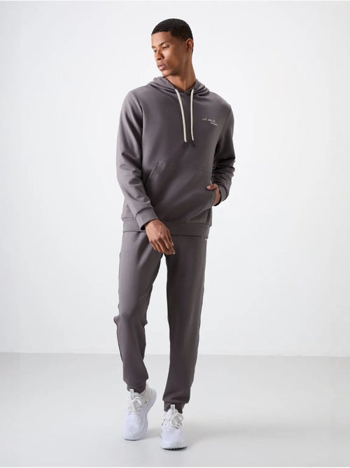 Conjunto de homem de sweatshirt com capuz e calças tommy - Kiabi Conjunto de homem de sweatshirt com capuz e calças tommy - Kiabi