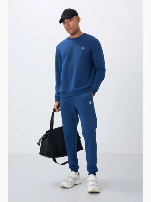 Conjunto de homem de sweatshirt e calças em felpa de algodão e poliéster tommy - Kiabi Conjunto de homem de sweatshirt e calças em felpa de algodão e poliéster tommy - Kiabi