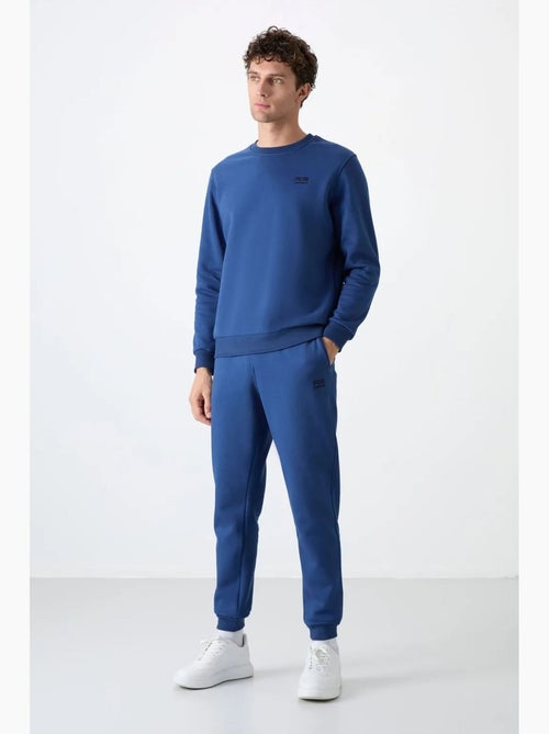 Conjunto de homem de sweatshirt e calças em felpa de algodão e poliéster tommy - Kiabi Conjunto de homem de sweatshirt e calças em felpa de algodão e poliéster tommy - Kiabi