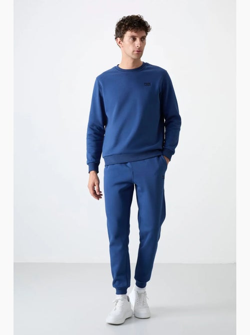 Conjunto de homem de sweatshirt e calças em felpa de algodão e poliéster tommy - Kiabi Conjunto de homem de sweatshirt e calças em felpa de algodão e poliéster tommy - Kiabi