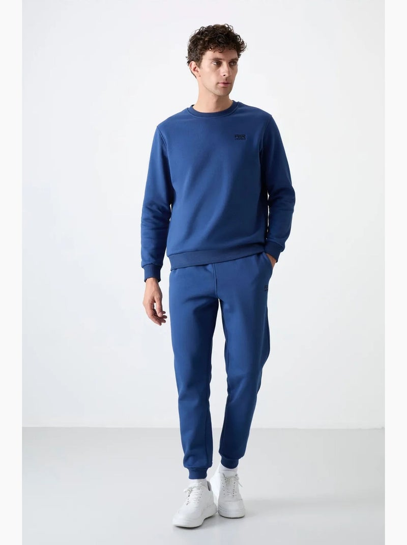 Conjunto de homem de sweatshirt e calças em felpa de algodão e poliéster tommy Azul - Kiabi