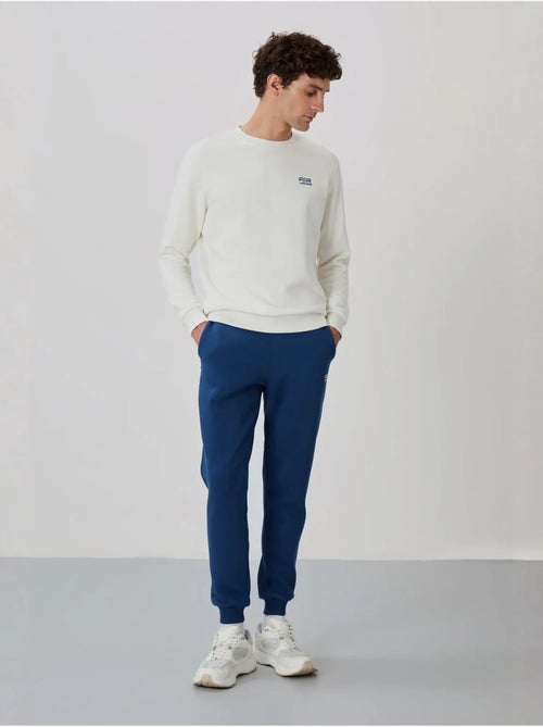 Conjunto de homem de sweatshirt e calças em felpa de algodão e poliéster tommy - Kiabi Conjunto de homem de sweatshirt e calças em felpa de algodão e poliéster tommy - Kiabi