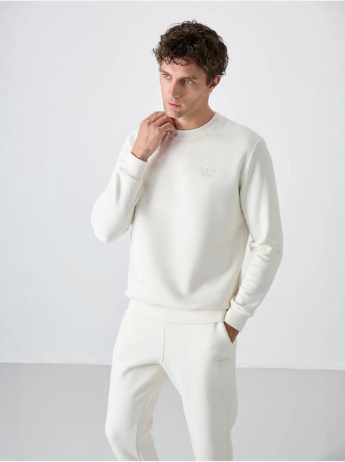 Conjunto de homem de sweatshirt e calças em felpa de algodão e poliéster tommy - Kiabi Conjunto de homem de sweatshirt e calças em felpa de algodão e poliéster tommy - Kiabi