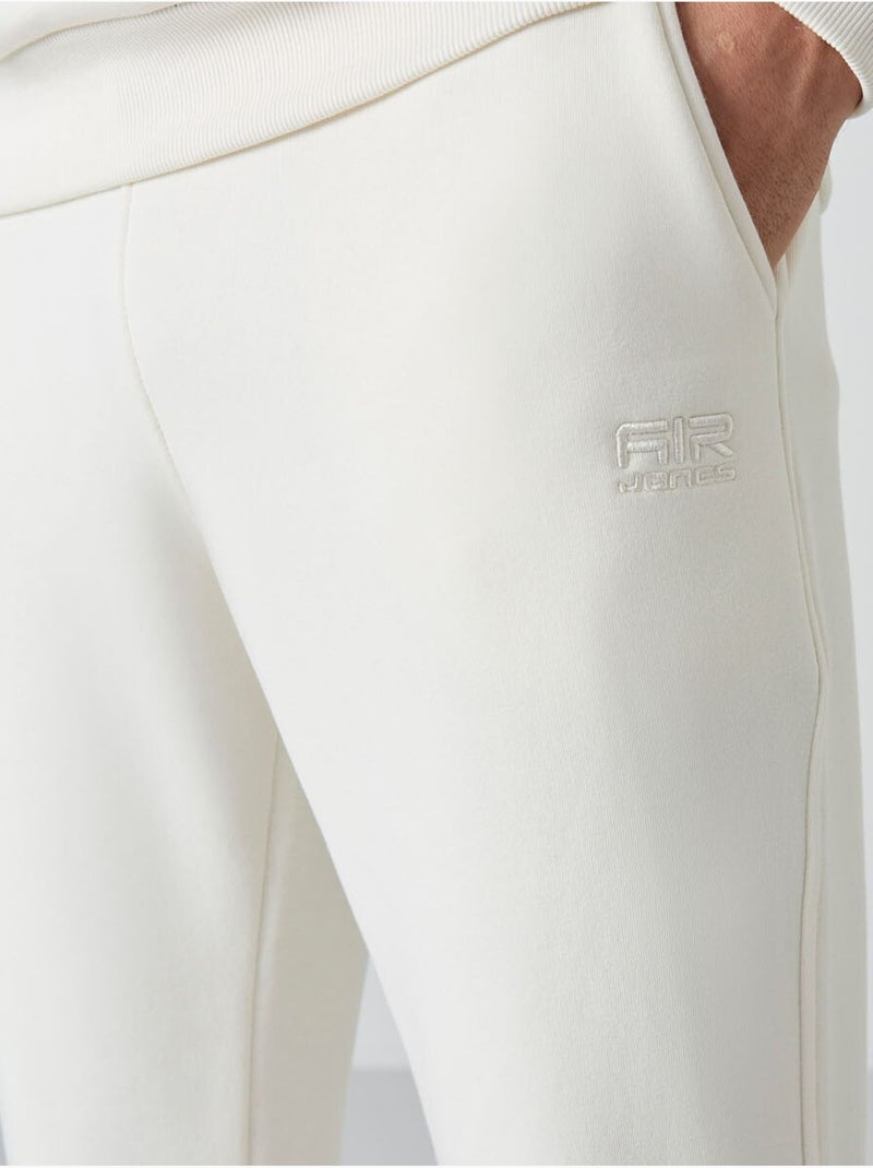 Conjunto de homem de sweatshirt e calças em felpa de algodão e poliéster tommy Branco sujo - Kiabi