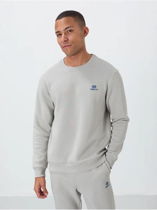 Conjunto de homem de sweatshirt e calças em felpa de algodão e poliéster tommy - Kiabi Conjunto de homem de sweatshirt e calças em felpa de algodão e poliéster tommy - Kiabi