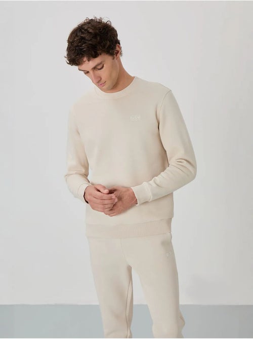 Conjunto de homem de sweatshirt e calças em felpa de algodão e poliéster tommy - Kiabi Conjunto de homem de sweatshirt e calças em felpa de algodão e poliéster tommy - Kiabi