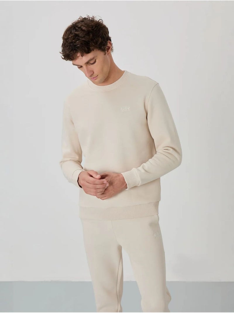 Conjunto de homem de sweatshirt e calças em felpa de algodão e poliéster tommy Ecru - Kiabi