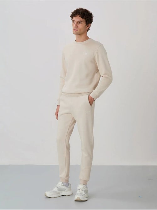 Conjunto de homem de sweatshirt e calças em felpa de algodão e poliéster tommy - Kiabi Conjunto de homem de sweatshirt e calças em felpa de algodão e poliéster tommy - Kiabi