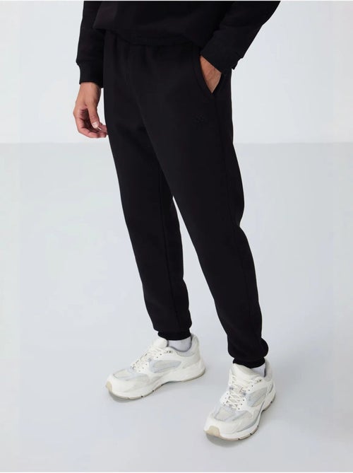 Conjunto de homem de sweatshirt e calças em felpa de algodão e poliéster tommy - Kiabi Conjunto de homem de sweatshirt e calças em felpa de algodão e poliéster tommy - Kiabi