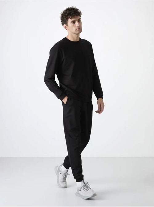 Conjunto de homem de sweatshirt em fleece e calças tommy - Kiabi Conjunto de homem de sweatshirt em fleece e calças tommy - Kiabi