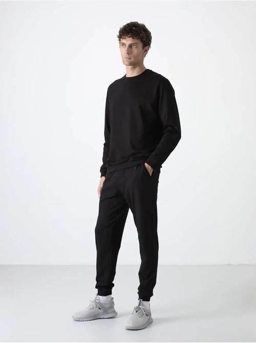 Conjunto de homem de sweatshirt em fleece e calças tommy - Kiabi Conjunto de homem de sweatshirt em fleece e calças tommy - Kiabi