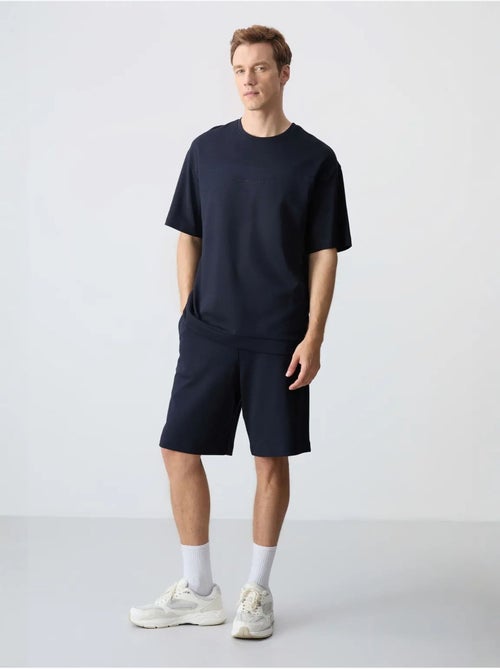 Conjunto de homem de t-shirt oversized e calções em mistura de algodão tommy - Kiabi Conjunto de homem de t-shirt oversized e calções em mistura de algodão tommy - Kiabi