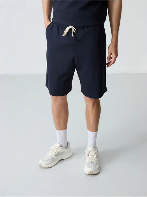 Conjunto de homem de t-shirt oversized e calções em mistura de algodão tommy - Kiabi Conjunto de homem de t-shirt oversized e calções em mistura de algodão tommy - Kiabi