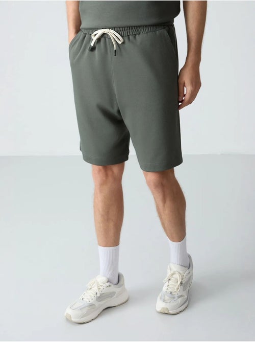 Conjunto de homem de t-shirt oversized e calções em mistura de algodão tommy - Kiabi Conjunto de homem de t-shirt oversized e calções em mistura de algodão tommy - Kiabi