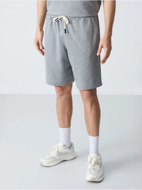 Conjunto de homem de t-shirt oversized e calções em mistura de algodão tommy - Kiabi Conjunto de homem de t-shirt oversized e calções em mistura de algodão tommy - Kiabi