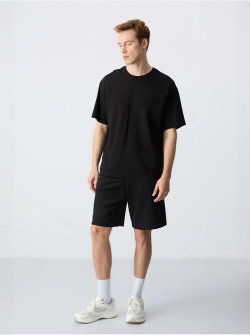 Conjunto de homem de t-shirt oversized e calções em mistura de algodão tommy - Kiabi Conjunto de homem de t-shirt oversized e calções em mistura de algodão tommy - Kiabi