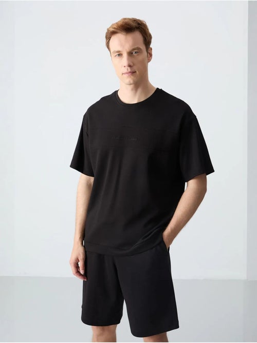 Conjunto de homem de t-shirt oversized e calções em mistura de algodão tommy - Kiabi Conjunto de homem de t-shirt oversized e calções em mistura de algodão tommy - Kiabi