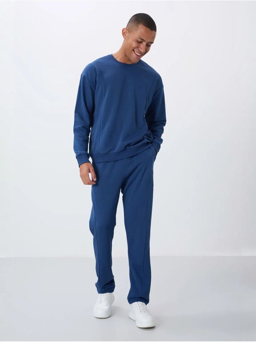 Conjunto de sweatshirt e calças em felpa de algodão e poliéster para homem tommy - Kiabi Conjunto de sweatshirt e calças em felpa de algodão e poliéster para homem tommy - Kiabi