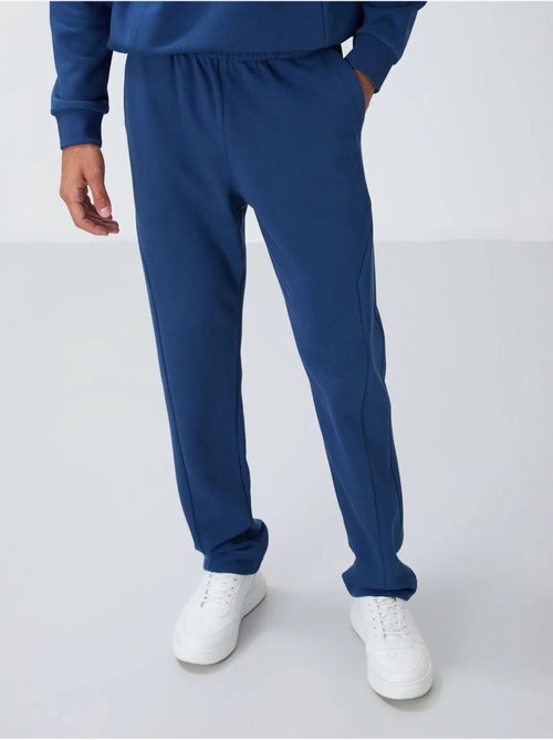 Conjunto de sweatshirt e calças em felpa de algodão e poliéster para homem tommy - Kiabi Conjunto de sweatshirt e calças em felpa de algodão e poliéster para homem tommy - Kiabi