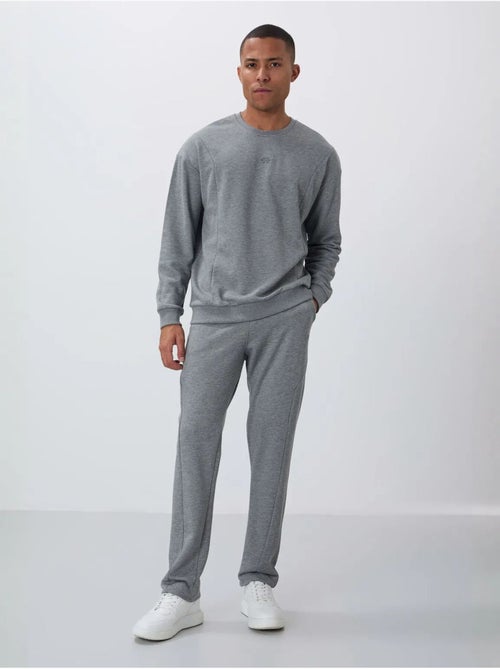 Conjunto de sweatshirt e calças em felpa de algodão e poliéster para homem tommy - Kiabi Conjunto de sweatshirt e calças em felpa de algodão e poliéster para homem tommy - Kiabi