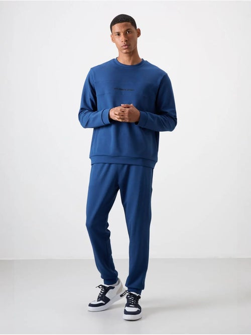 Conjunto de sweatshirt e calças em fleece estampado tommy - Kiabi Conjunto de sweatshirt e calças em fleece estampado tommy - Kiabi