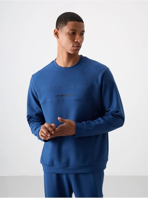 Conjunto de sweatshirt e calças em fleece estampado tommy - Kiabi Conjunto de sweatshirt e calças em fleece estampado tommy - Kiabi
