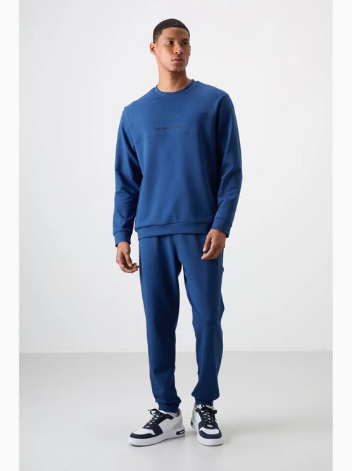 Conjunto de sweatshirt e calças em fleece estampado tommy - Kiabi Conjunto de sweatshirt e calças em fleece estampado tommy - Kiabi
