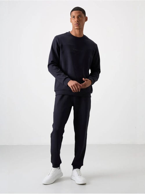 Conjunto de sweatshirt e calças em fleece estampado tommy - Kiabi Conjunto de sweatshirt e calças em fleece estampado tommy - Kiabi
