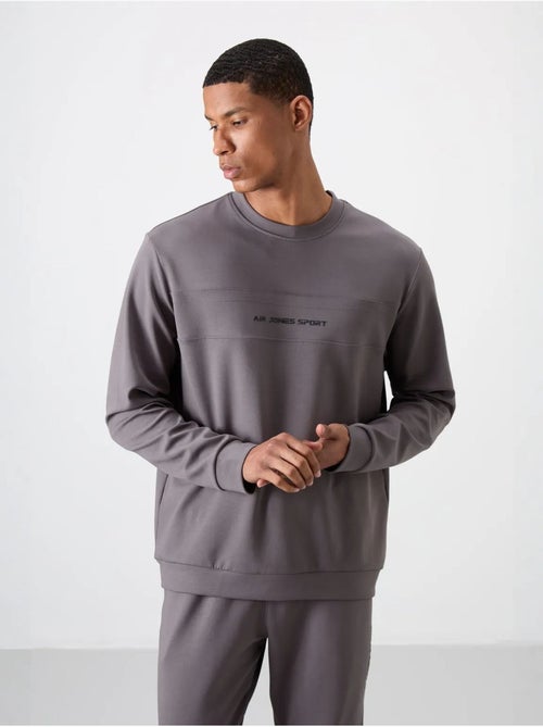 Conjunto de sweatshirt e calças em fleece estampado tommy - Kiabi Conjunto de sweatshirt e calças em fleece estampado tommy - Kiabi
