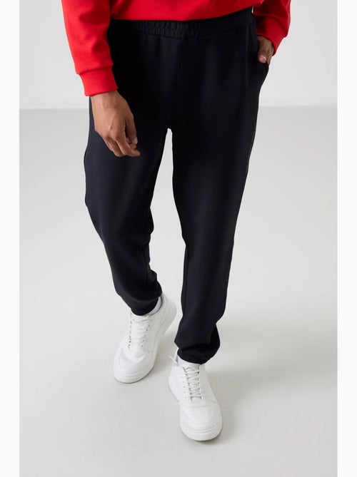 Conjunto de sweatshirt e calças em fleece estampado tommy - Kiabi Conjunto de sweatshirt e calças em fleece estampado tommy - Kiabi