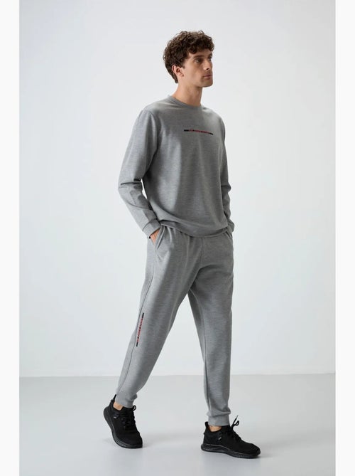 Conjunto de sweatshirt e calças em malha canelada para homem tommy - Kiabi Conjunto de sweatshirt e calças em malha canelada para homem tommy - Kiabi