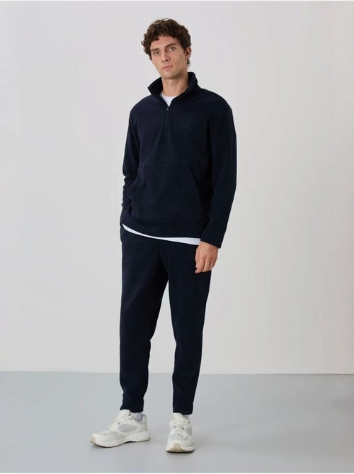 Conjunto de sweatshirt e calças em polar de poliéster para homem tommy - Kiabi Conjunto de sweatshirt e calças em polar de poliéster para homem tommy - Kiabi