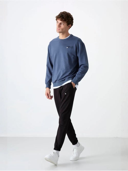Conjunto de sweatshirt e calças oversize gola redonda tommy - Kiabi Conjunto de sweatshirt e calças oversize gola redonda tommy - Kiabi