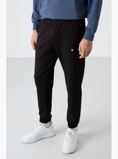 Conjunto de sweatshirt e calças oversize gola redonda tommy - Kiabi Conjunto de sweatshirt e calças oversize gola redonda tommy - Kiabi