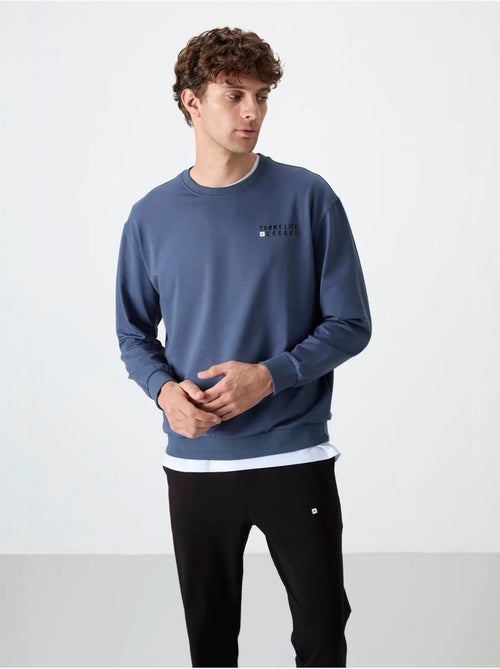 Conjunto de sweatshirt e calças oversize gola redonda tommy - Kiabi Conjunto de sweatshirt e calças oversize gola redonda tommy - Kiabi