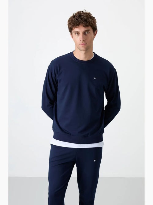 Conjunto de sweatshirt e calças oversize gola redonda tommy - Kiabi Conjunto de sweatshirt e calças oversize gola redonda tommy - Kiabi