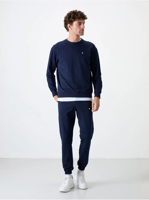 Conjunto de sweatshirt e calças oversize gola redonda tommy - Kiabi Conjunto de sweatshirt e calças oversize gola redonda tommy - Kiabi