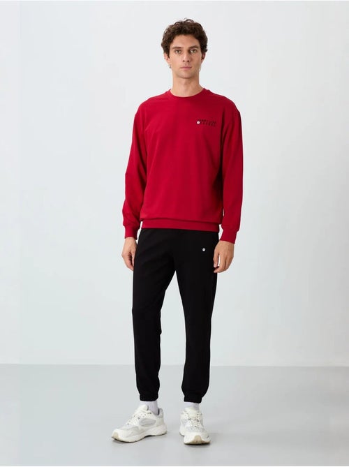 Conjunto de sweatshirt e calças oversize gola redonda tommy - Kiabi Conjunto de sweatshirt e calças oversize gola redonda tommy - Kiabi