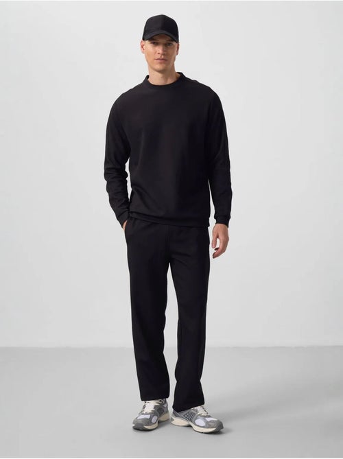 Conjunto de sweatshirt oversized e calças de homem tommy - Kiabi Conjunto de sweatshirt oversized e calças de homem tommy - Kiabi