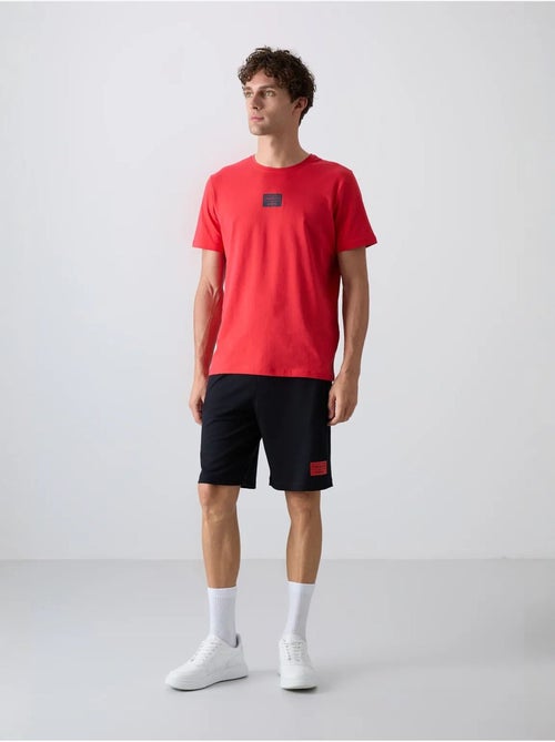 Conjunto de t-shirt e calções em jersey de algodão estampado tommy - Kiabi Conjunto de t-shirt e calções em jersey de algodão estampado tommy - Kiabi